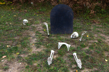 Outdoor Halloween Decorations. Skeletons and blank black tombstone are easy outdoor Halloween...