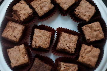 Chocolate brownie squares on cutting board