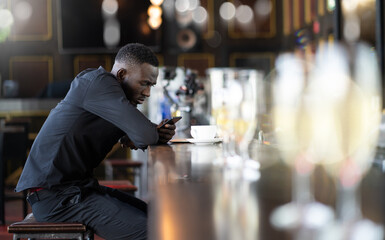 Portrait of confident African American businessman at nightclub.