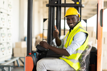 Warehouse man worker driver forklift. warehouse worker driver stacking card boxes by forklift in...