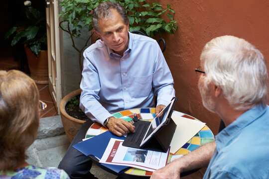 Experienced real estate agent listens attentively to customers