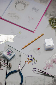 Jeweler's tools and gemstones on the table