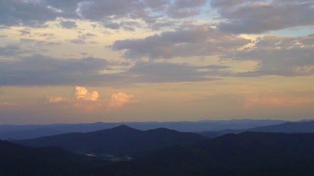 Sunset over the mountain landscapes, time lapse