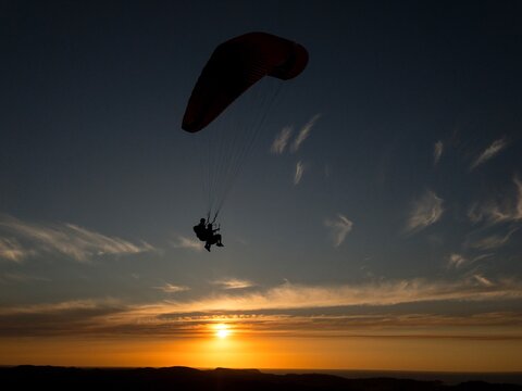 Paragliding at sunset.