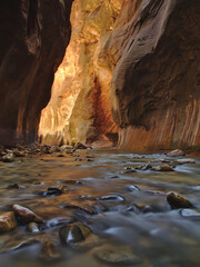 Long exposure shot with flowing river in Zion National Park Narrows, Utah, USA