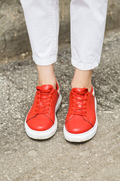 red sneakers and white pants