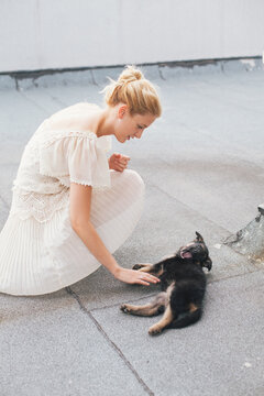 Woman playing with her small dog