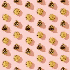 Natural pine cones golden colored as New Year pattern.