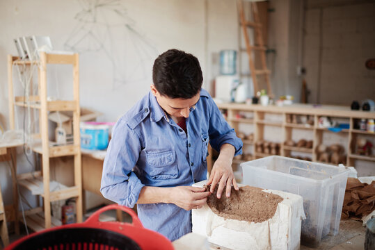 Handyman creating paper mache masterpiece