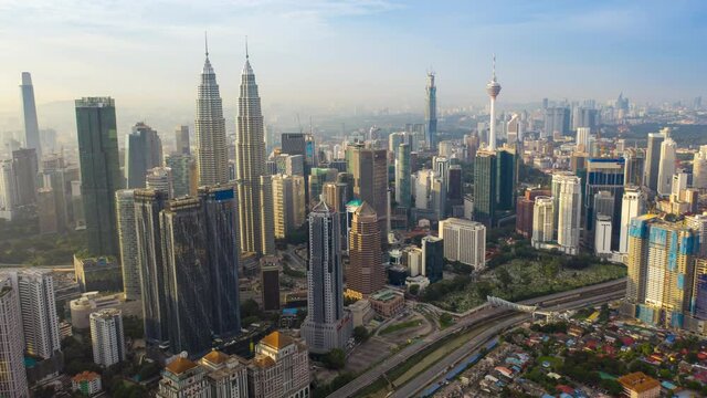 aerial view hyperlapse 4k video of Kuala Lumpur city center view during dawn overlooking the city skyline in Federal Territory, Malaysia. petronas twin towers hyper lapse.	
