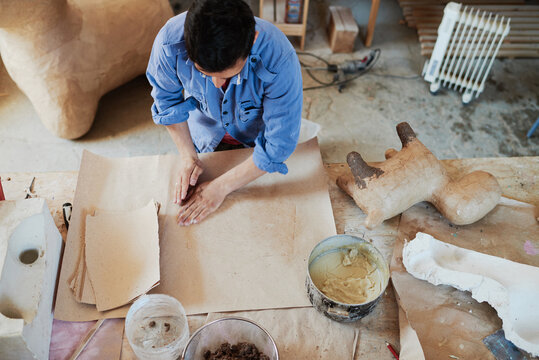 Handyman working with kraft paper