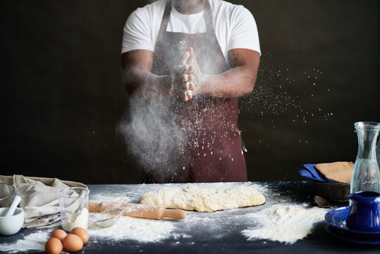 Cook getting rid of extra flour