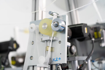Machines are working for producing masks in a sterile factory. Production of medical masks. process of manufacturing a mask