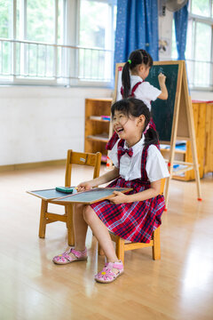 Two litte asian girl in the kindergarten