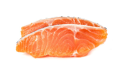 Piece of fresh salmon fillet sliced isolated on white background