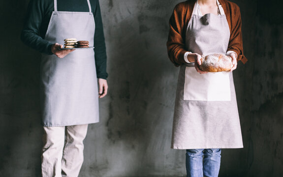 Couple Holding Bakery Products