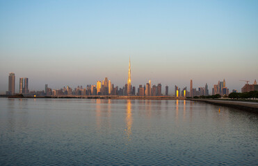 Fototapeta na wymiar Sunrise over a skyline of a beautiful city of Dubai. Shot made in Jadaf area of the city. UAE.