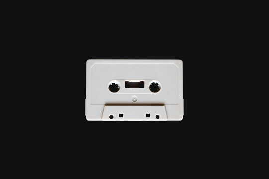 White cassette tape on black background