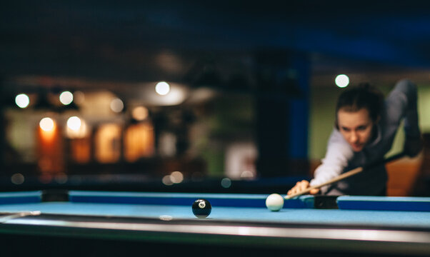 Woman playing pool game