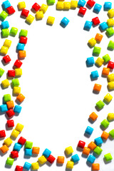 Obraz premium Candy. Colorful candy frame on a white background top view frame copy space. Chewing gum, and dragees are scattered. Space for text in the middle. Advertising label design element.