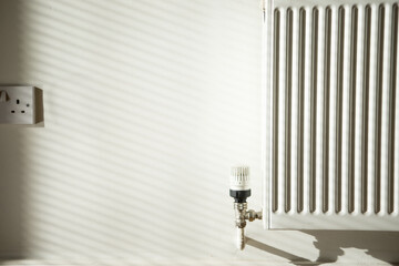 Heater on a White Wall . Concept