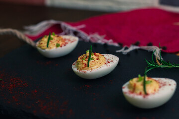 Devil Eggs with rosemary and paprika