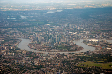 Overlooking the urban sprawl of the city of London from an airplane 