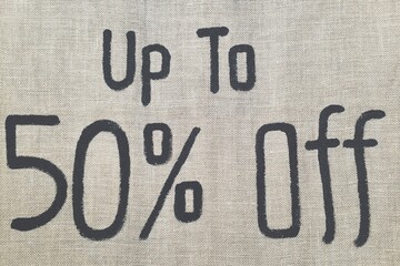 Sign on a retail store offering 50 percent discount.