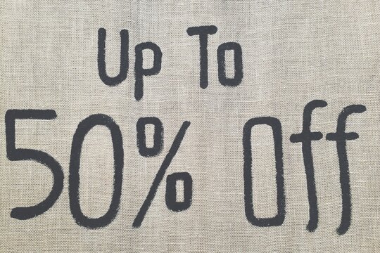 Sign on a retail store offering 50 percent discount.