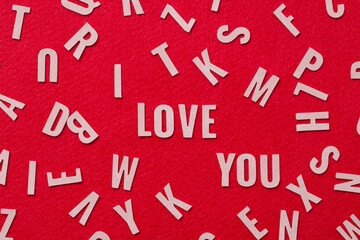 letters  leather mixed, with I Love You alphabet in the center on red background , I love you concept.