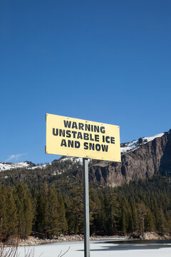 Sign in the sierras warning of unstable ice and snow falling