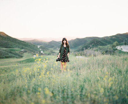 Woman Walking In Open Field