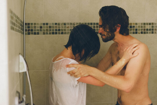 Fighting Couple Standing in a Shower