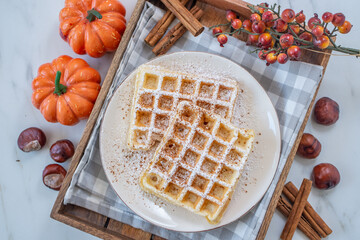 sweet home made pumpkin spice waffles on a table
