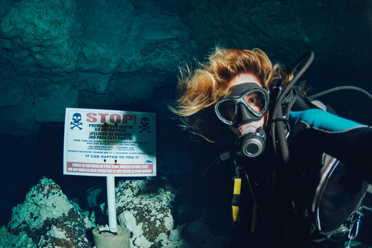 Woman cavern diving
