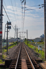 Fototapeta premium straight rails running through the city