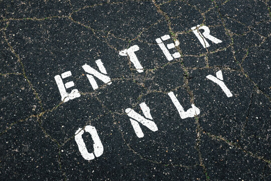 The words ""ENTER ONLY"" written on street
