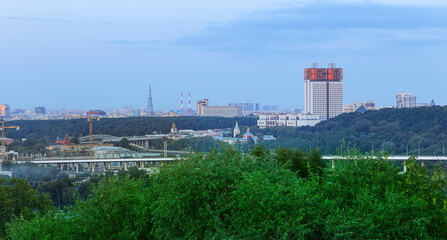 view of central Moscow from Sparrow Hills or Vorobyovy Gory observation (viewing) platform at sunset-- is on a steep bank 85 m above the Moskva river, or 200 m above sea level. Russia