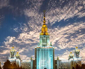 Fototapeta na wymiar Lomonosov Moscow State University on Sparrow Hills (against the background of a beautiful sunset), main building, Russia. It is the highest-ranking Russian educational institution