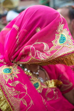 Rajasthani woman covering her face with a sari
