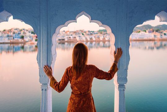 Tourist Woman At Indian Holy Lake, Back View