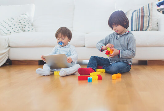 Portrait of a 1year old boy with his 5 year old brother