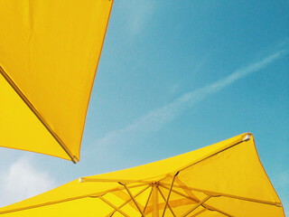 Under yellow umbrella