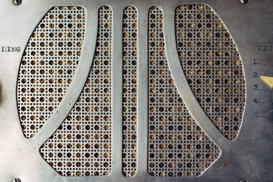 Metallic speaker baffle on an old record cutting machine