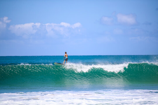 Surfing At Hanalei Beach, Kauai, Hawaii