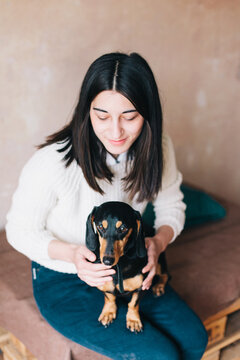 Woman with her dog indoor