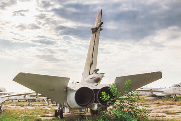 Old jet plane stands at an abandoned airfield