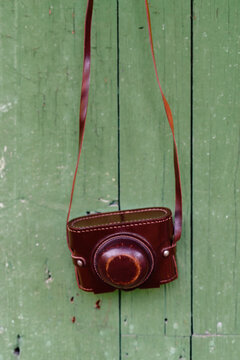 Vintage film camera hanging on wall
