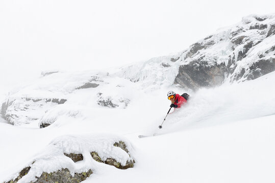 Skier making a turn in deep snow