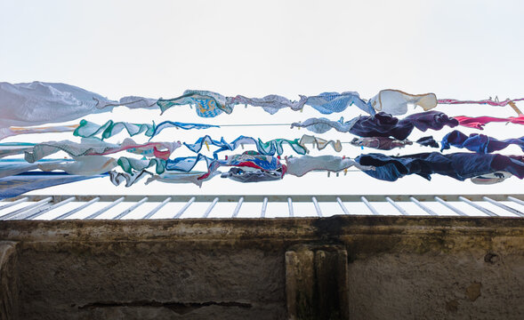 Low angle view of laundry hanging against building